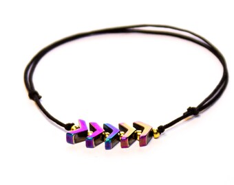 Bracelet with arrows. Rainbow oil slick