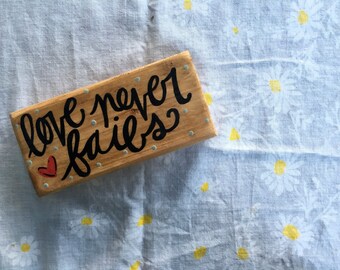 Love Never Fails // wood sign.