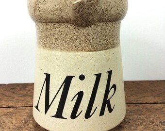 Rustic stoneware milk jug or pitcher, with the large word 'Milk' on, made in England