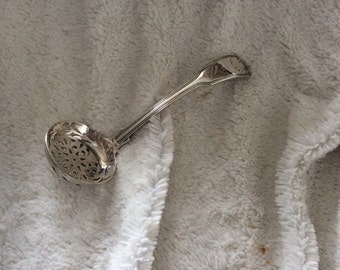 Vintage imported silver sifter spoon