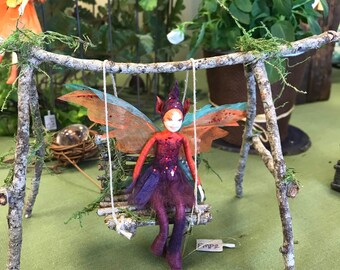 fairy on a swing figurine