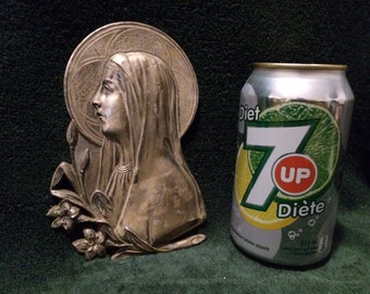 Sculpture bas relief in tin of saint marie