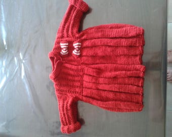 red coat with pleats and bows