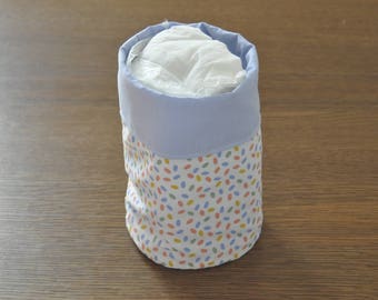 reversible round pouch with polka dots and plain blue fabric