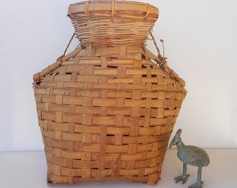 Old vintage basket in unusual shape with handle