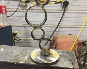 Metal cylinder sculpture