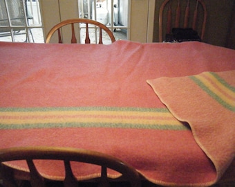 100% WOOL BLANKET in beautiful condition. Pink with pastel stripes . Measures 60 by 80 inches. Very clean..no matting or balls.