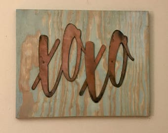 Metal XOXO on 15"x12" board.