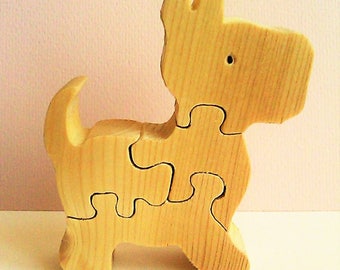 Puzzle wooden four pieces for the awakening of children.