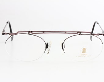 Neostyle Mozart 34 90s modernist avant garde eyeglasses, ultraslim pink enamelled gunmetal frames half rimmed, made in Germany NOS 1990s