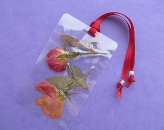 Pressed flowers bookmark. Laminated bookmark with real pressed flowers. One of a kind bookmark made from nature.