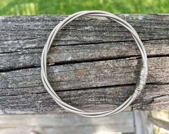 Recycled guitar string bracelet