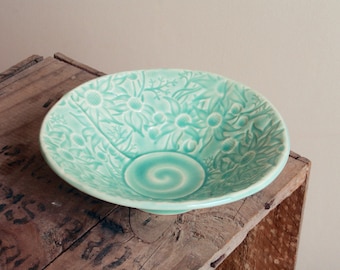 Stoneware bowl in teal glaze with Australian Flannel Flower design