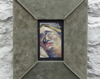 An acrylic painting of a women’s face