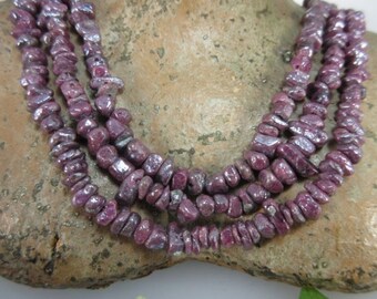Ruby crystals as Strand steamed with silver on steel strand