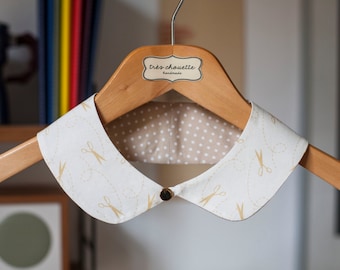 Cotton Peter Pan collar with gold plated button closure, featuring a sewing inspired pattern.