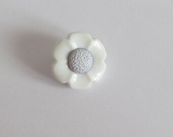 Gray and white flower shaped button