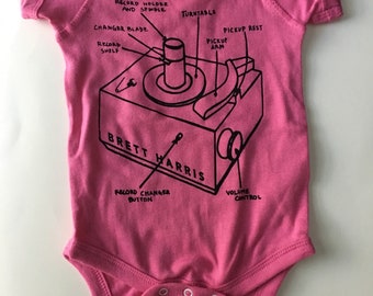 Brett Harris 45 Player one-piece, bodysuit, romper, size 6 months, pink with black print