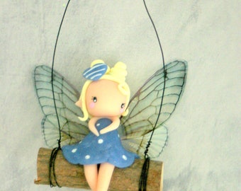 fairy on a swing figurine