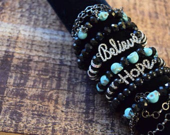 Past Forever Collection 7 strand stackable stretch bracelet set 3, black and teal skull beads