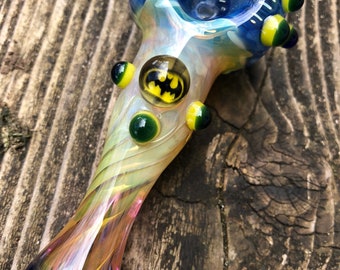 BATMAN Glass pipe BATMAN millie with yellow and blue highlights. Fumed with silver and gold, color changing. Awesome piece