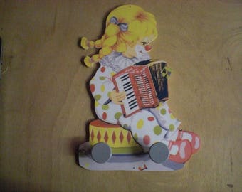 LITTLE GIRL CLOWN ACCORDION WALL RACK