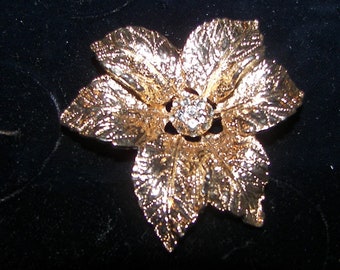 Vintage Judy Lee goldtone and rhinestone brooch flower