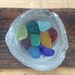 Colourful sea glass bottle base display