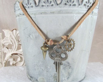 Vintage Found Items charm Dangle necklace on Suede cord