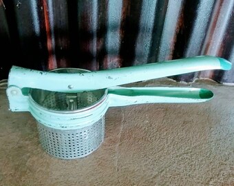 Vintage sea foam green potato ricer