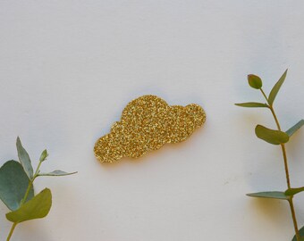This brooch glittery gold