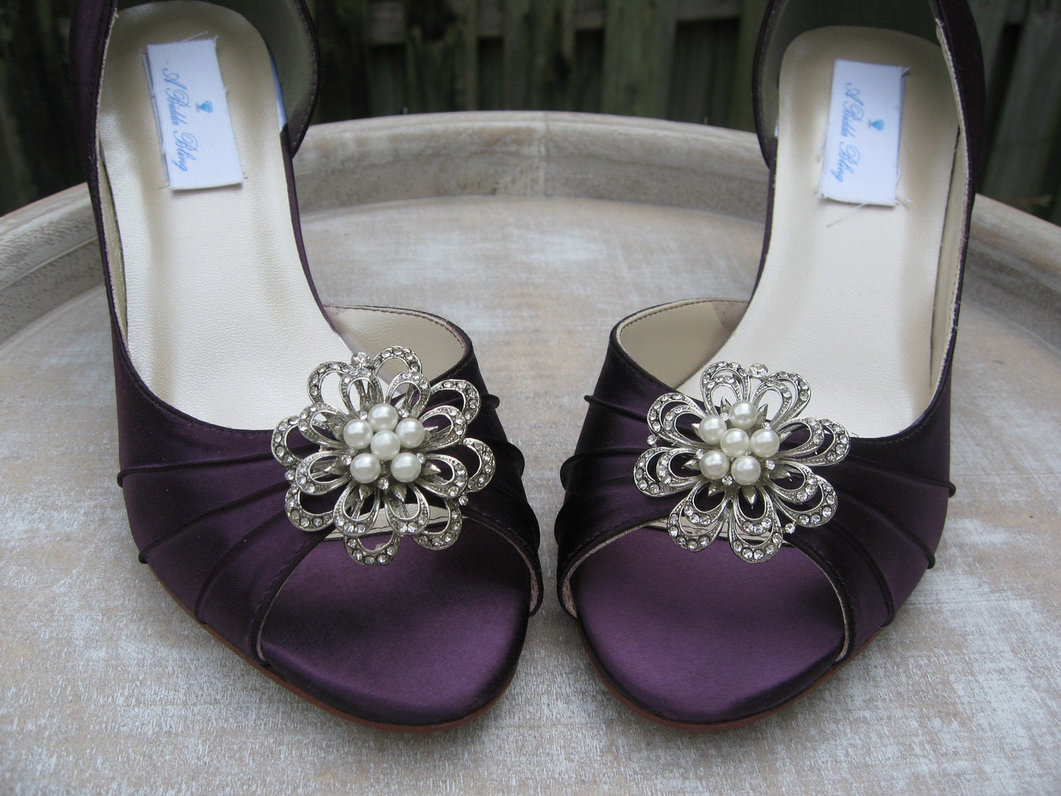These vintage inspired eggplant purple shoes have been hand dyed and then embellished with a vintage style pearl and crystal brooch. Perfect for your wedding da