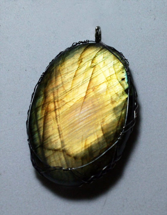 Labradorite pendant wrapped in a sterling silver Celtic design