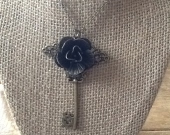 Skeleton key with a rose.