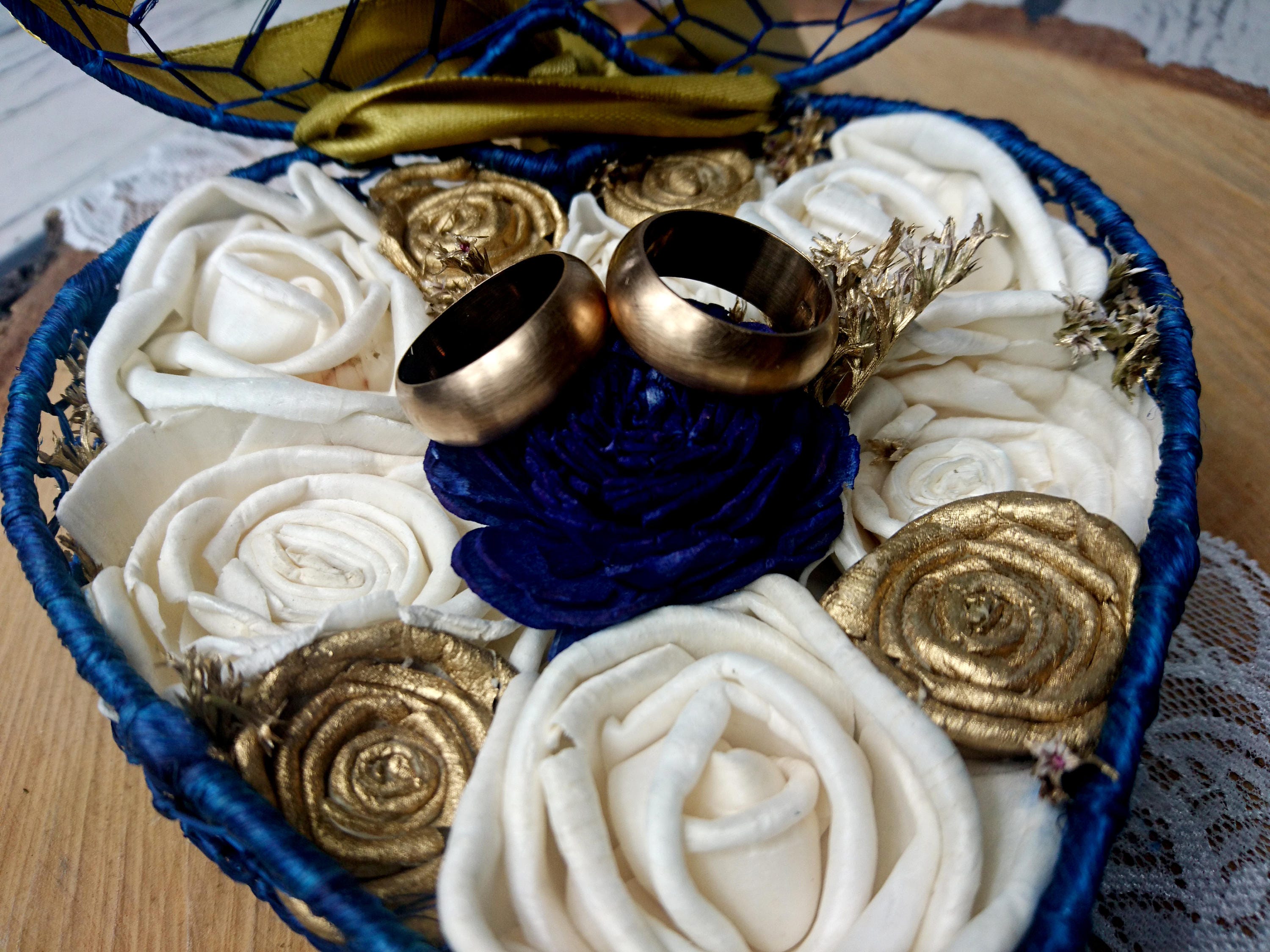 Navy blue gold wedding rings box with sola flowers