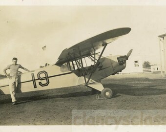 vintage photo 1950 Stripe Guy Stands by No.19 Bi Plane Airplane