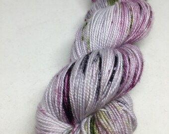 Hand dyed yarn speckled in purples and greens. A perfect yarn for your next project Think "fade", shawl, socks and more. 40
