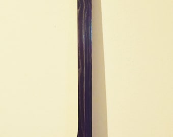 Diddley Electric Bow to a rope. In Ash and Mahogany.