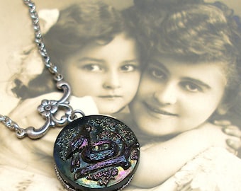 Mama BIRD BUTTON necklace, Victorian black glass with rainbow luster, on silver chain. 1800s button jewellery.