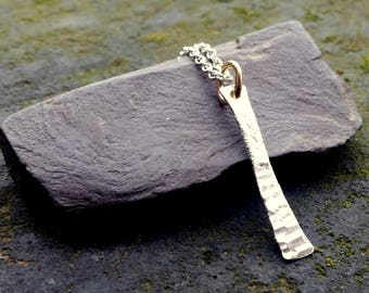 Silver bar pendant with gold hoop
