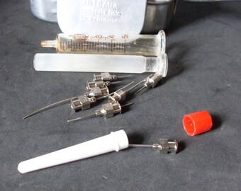 vintage glass syringe, syringe for injections, body care item, syringe to inject medicines, aluminium box