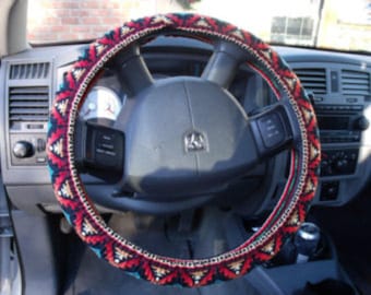 A Turquoise/Rust Aztec print, Steering Wheel Cover Custom Made.