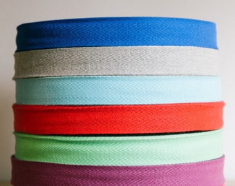 1" cotton twill tape, herringbone tape, 50 yard roll, over 200 colour choices. Wholesale ribbons / apron ties / flat tape.