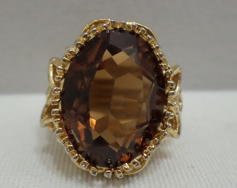18K HGE gold ring with a brown amber colored stone size 7 costume jewelry
