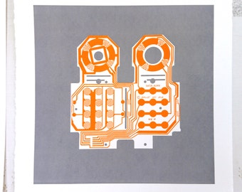 Mattel Intellivision controller screen print orange and grey art silkscreen circuit portrait retro console