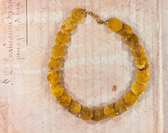 Vintage necklace made of flat plastic beads