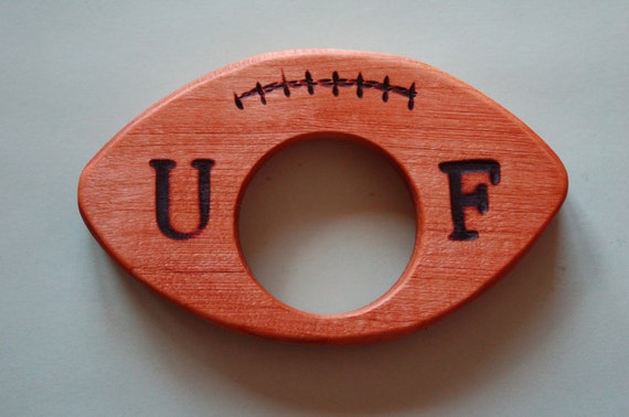 football wooden rattle