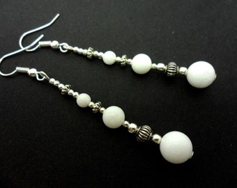 A pair of pretty white jade bead silver plated long dangly earrings.