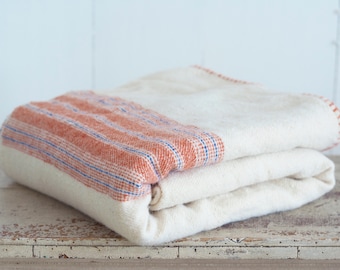 Hand Woven Blanket in a White Cream Color With Orange and Blue Stripes