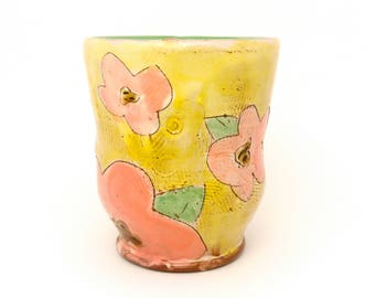 Puffy Floral Earthenware Tumbler. Wheel thrown and altered, food safe cup, made by Kaitlyn Brennan/ Brennan pottery